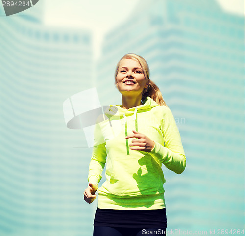Image of woman jogging outdoors