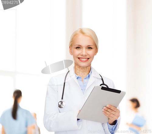 Image of female doctor with stethoscope and tablet pc