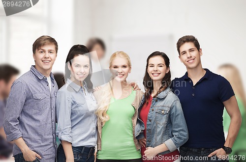 Image of group of standing smiling students