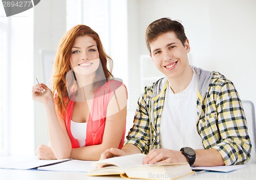 Image of students with textbooks and books at school