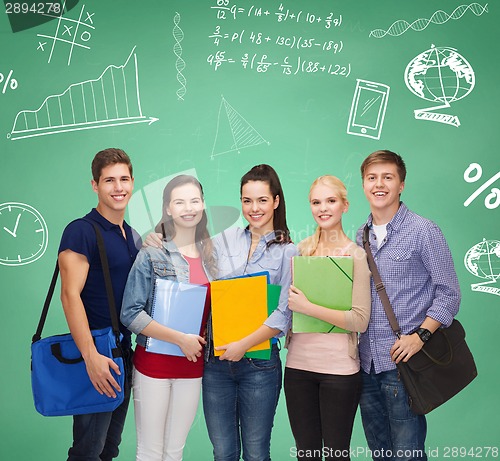 Image of group of smiling students with folders and bags