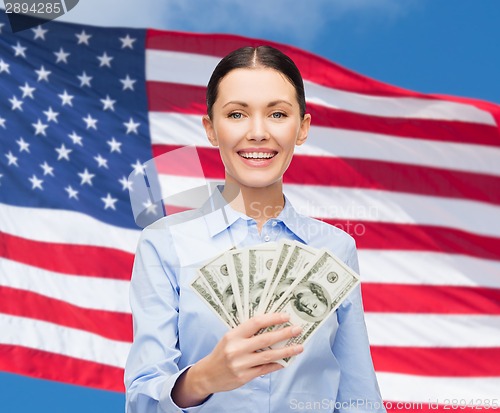 Image of businesswoman with dollar cash money