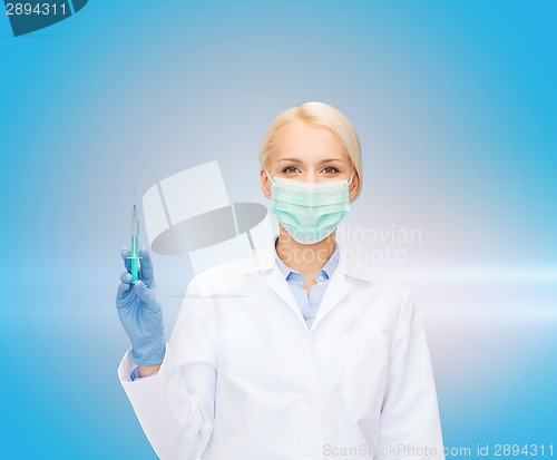 Image of doctor in mask holding syringe with injection