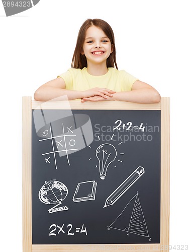 Image of smiling girl with blackboard