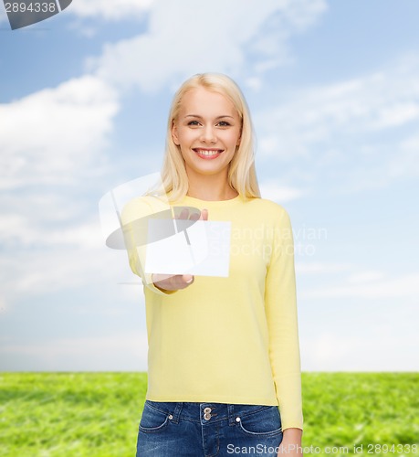 Image of smiling girl with blank business or name card