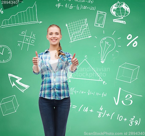 Image of smiling student girl showing thumbs up