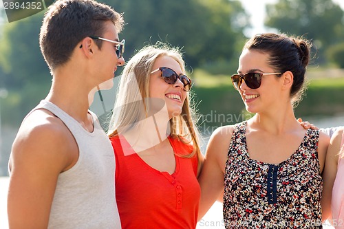 Image of group of smiling friends in city