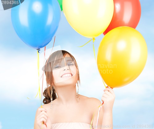 Image of happy teenage girl with balloons