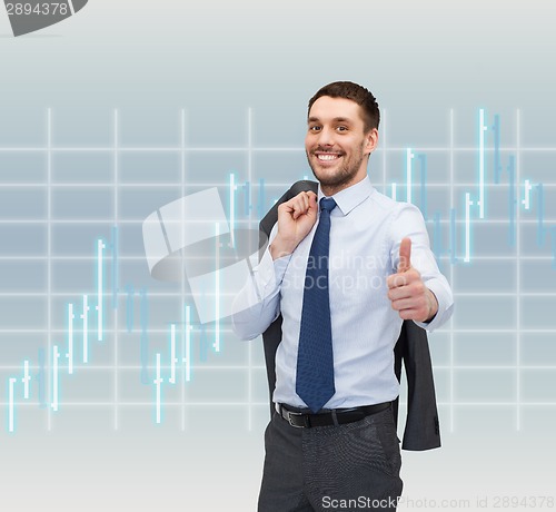 Image of smiling young businessman showing thumbs up