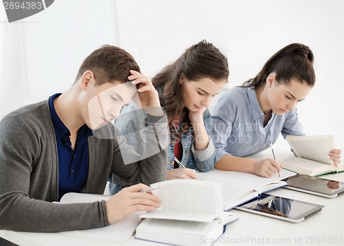 Image of students with notebooks and tablet pc at school