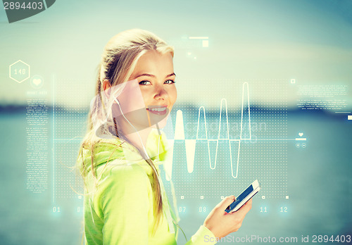 Image of woman listening to music outdoors