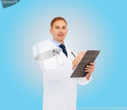 Image of smiling male doctor with clipboard and stethoscope