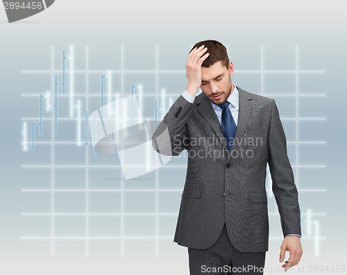 Image of handsome businessman having headache