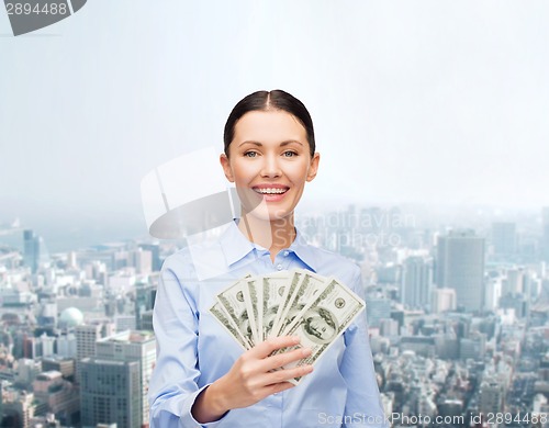 Image of businesswoman with dollar cash money