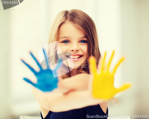 Image of girl showing painted hands