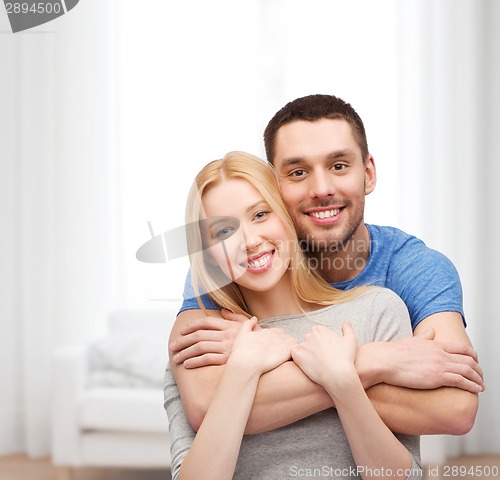Image of smiling couple hugging