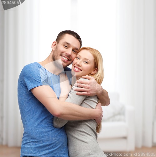 Image of smiling couple hugging