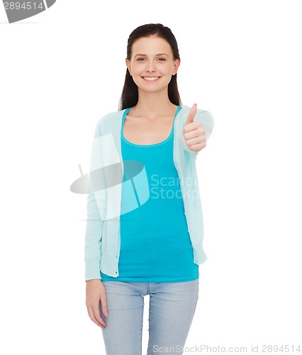 Image of smiling teenage girl showing thumbs up