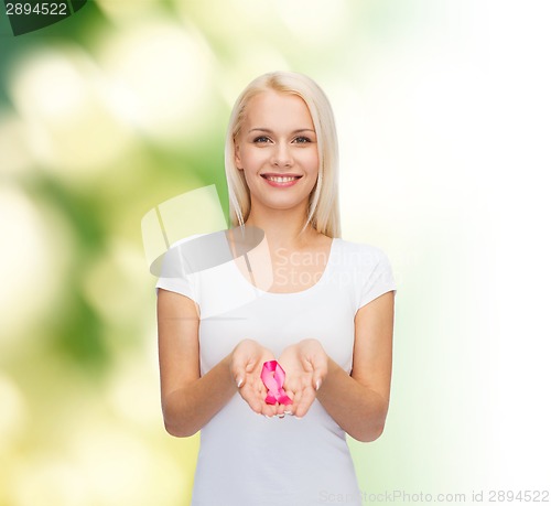 Image of woman holding pink cancer awareness ribbon