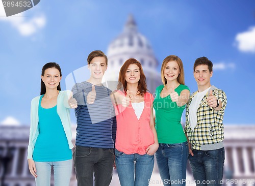 Image of group of smiling students showing thumbs up