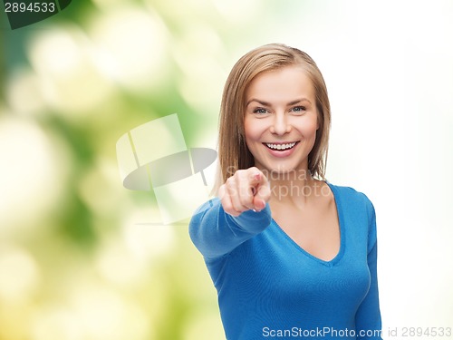Image of smiling student pointing finger at you