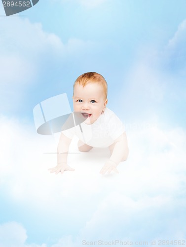 Image of crawling smiling baby looking up