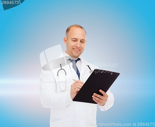 Image of smiling male doctor with clipboard and stethoscope