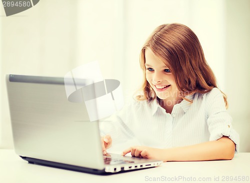 Image of girl with laptop pc at school