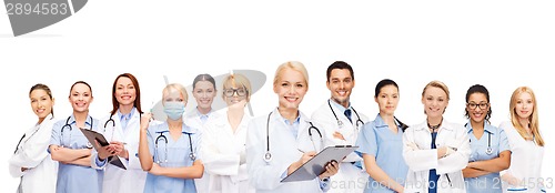 Image of smiling female doctors and nurses with stethoscope