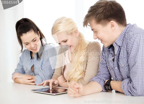 Image of smiling students with tablet pc computer at school