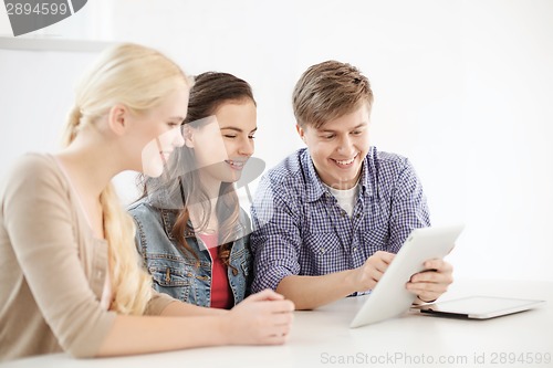 Image of smiling students with tablet pc computer at school