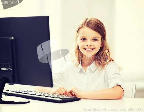 Image of student girl with computer at school