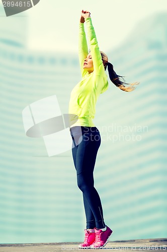 Image of woman doing yoga outdoors