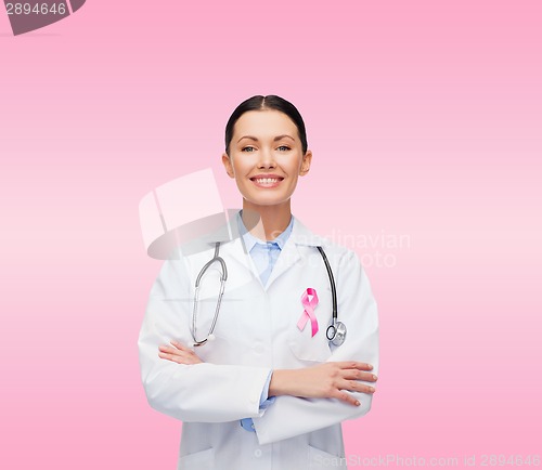 Image of doctor with stethoscope, cancer awareness ribbon