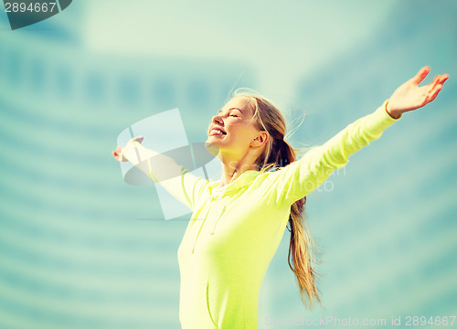 Image of woman doing sports outdoors