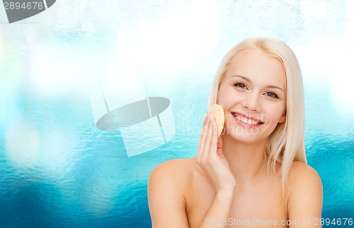 Image of beautiful woman with sponge