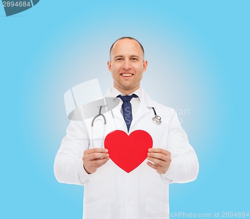 Image of smiling male doctor with red heart and stethoscope