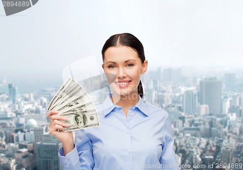 Image of businesswoman with dollar cash money