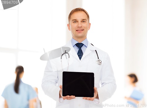 Image of smiling male doctor with stethoscope and tablet pc