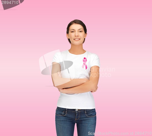 Image of smiling woman with pink cancer awareness ribbon