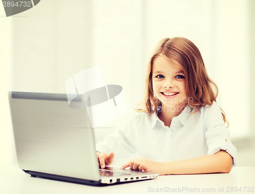 Image of girl with laptop pc at school