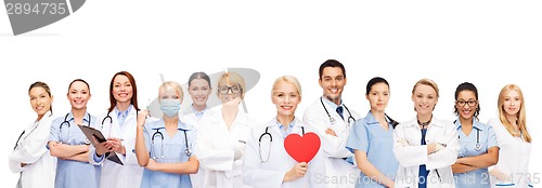 Image of smiling doctors and nurses with red heart