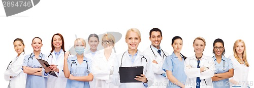 Image of smiling female doctors and nurses with stethoscope