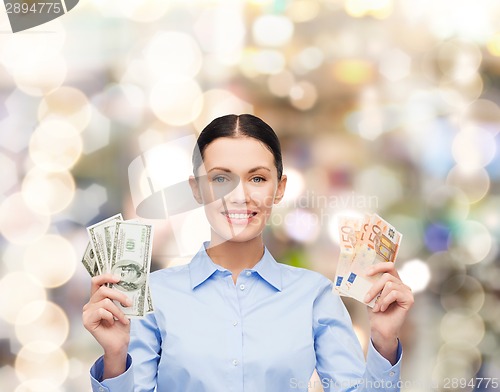 Image of businesswoman with dollar cash money