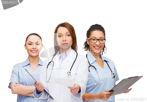 Image of calm female doctor with clipboard