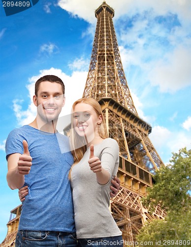 Image of smiling couple showing thumbs up