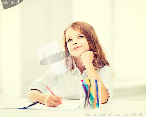 Image of little student girl drawing at school