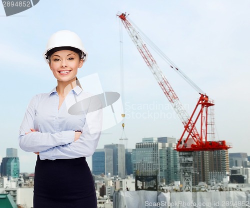 Image of businesswoman in white helmet