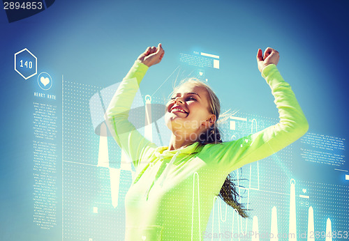 Image of woman runner celebrating victory