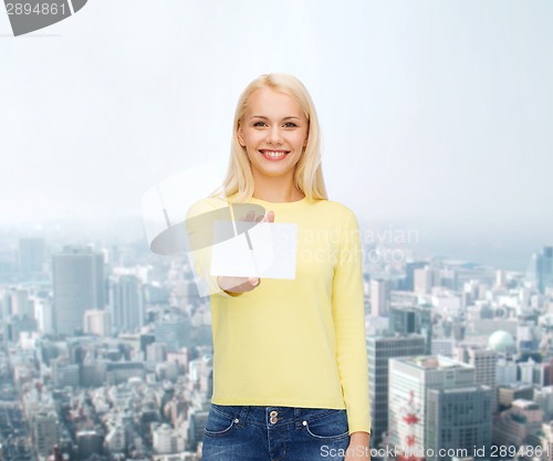 Image of smiling girl with blank business or name card